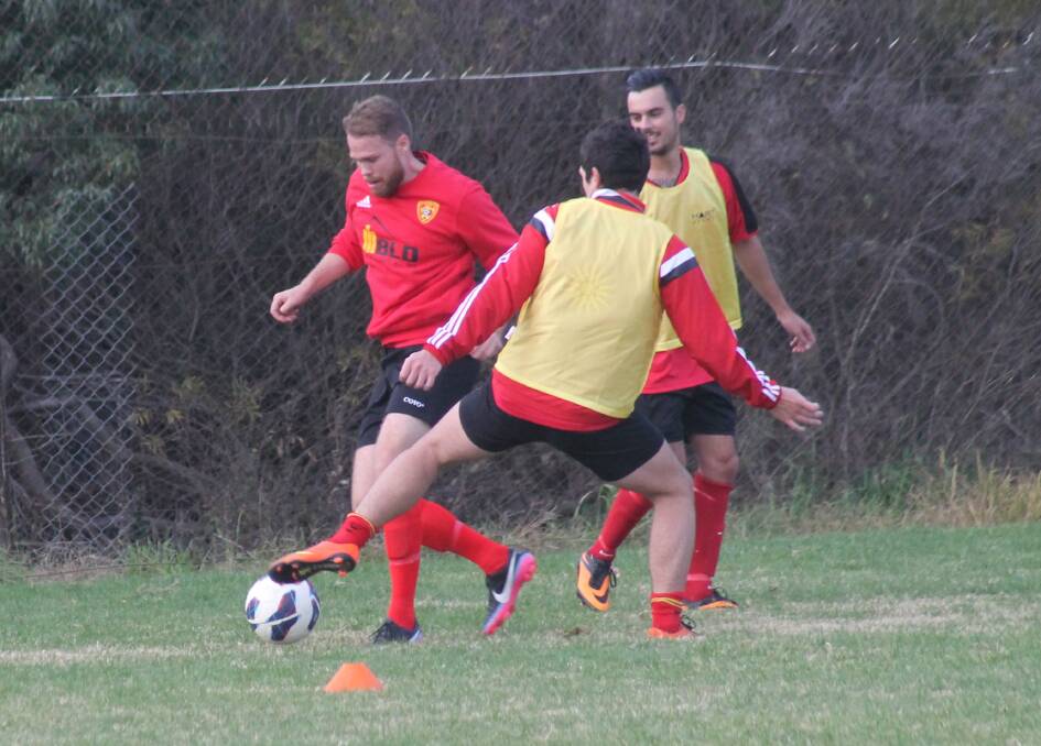 Queanbeyan City players go through a pre-match warm up back in May. Photo: Joshua Matic.