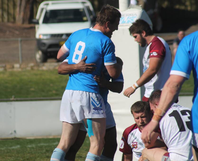 The Queanbeyan Blues reserves celebrate one of their tries on Sunday afternoon. Photo: Joshua Matic.