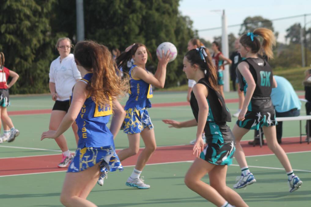 The Sunrise and Jerrabomberra Cadets teams went head-to-head in round three action at the Queanbeyan netball courts last Saturday. Photo: Joshua Matic.