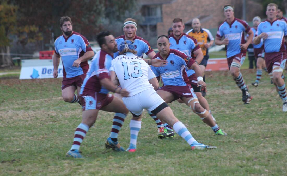 Queanbeyan Whites centre HP Momsen takes a hit against Wests Lions at Campese Field last month. Photo: Joshua Matic.