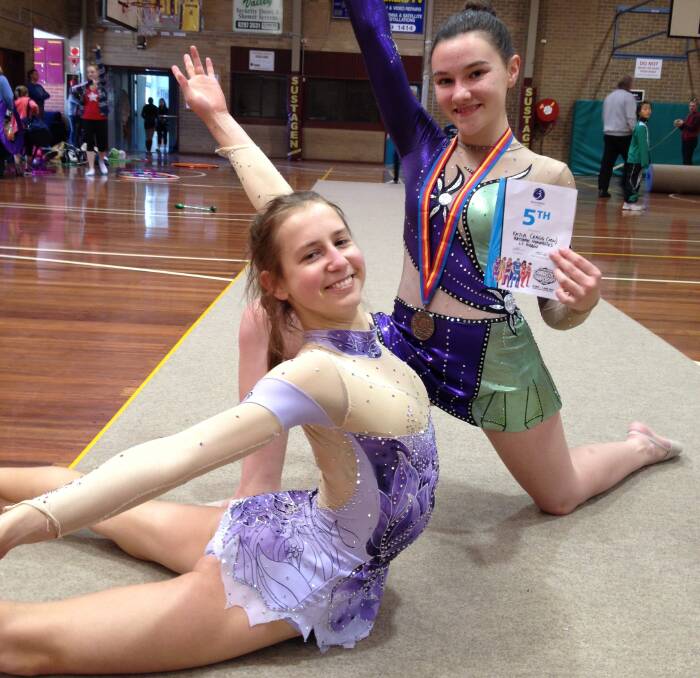 Queanbeyan YMCA gymnasts Vera Chalneva and Kayla Cragg after their events in Melbourne. Photo: Peta Virgo.