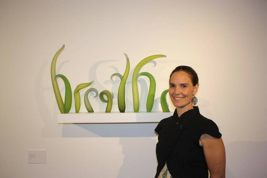 Queanbeyan glass artist Harriet Schwarzrock with her work titled 'breathe' which is currently being exhibited at the Canberra Glassworks. Photo: Beverly Growden.