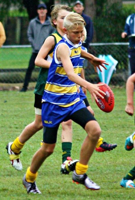 Posthuma in action for the South Coast Marlins at the NSW School Sport AFL Carnival in Nelson Bay. Photo: Supplied. 