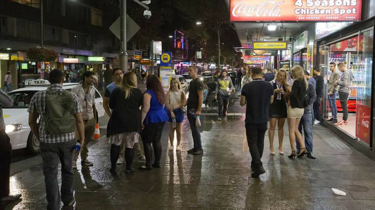 Homeward bound: partygoers fill the streets of Kings Cross on the first weekend of new lockout laws Photo: Steve Lunam