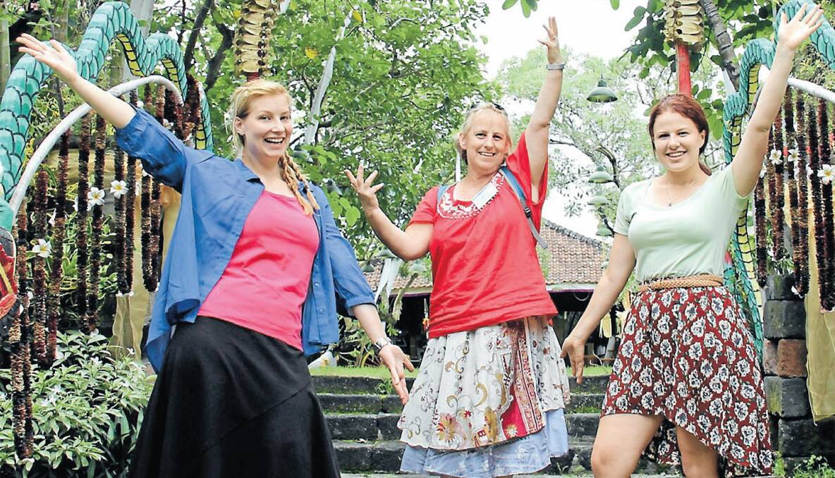 Rosemary Smith (centre) soaking up the local Indonesian culture. 								   Photo: supplied. 