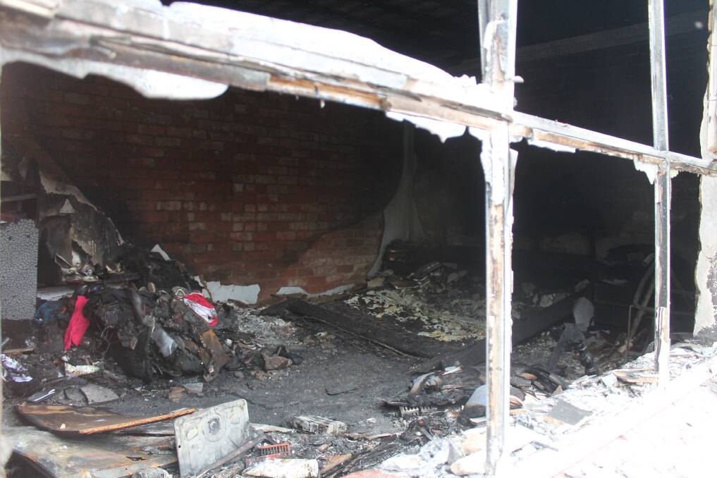 The ruins of the burnt out Cassidy Street unit following Sunday's fire. Photos: Andrew Johnston, Queanbeyan Age