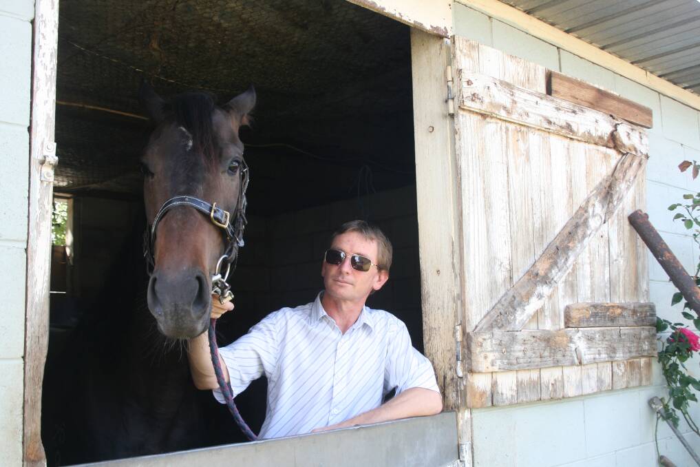 Trainer Chris Coleman with last-start winner Scarlet Wings at his Queanbeyan stable. Photo: Andrew Johnston
