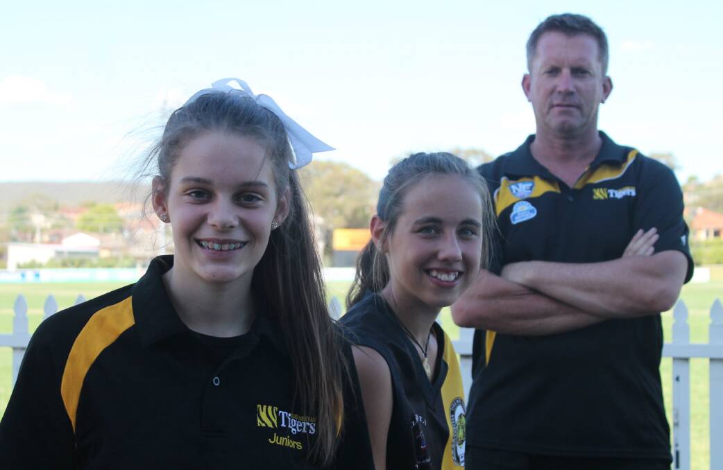 Inaugural Queanbeyan Tigers Youth Girls representatives Spencer Hoadley and Lexi Silsby with coach Paul Lyons. Photo: Andrew Johnston