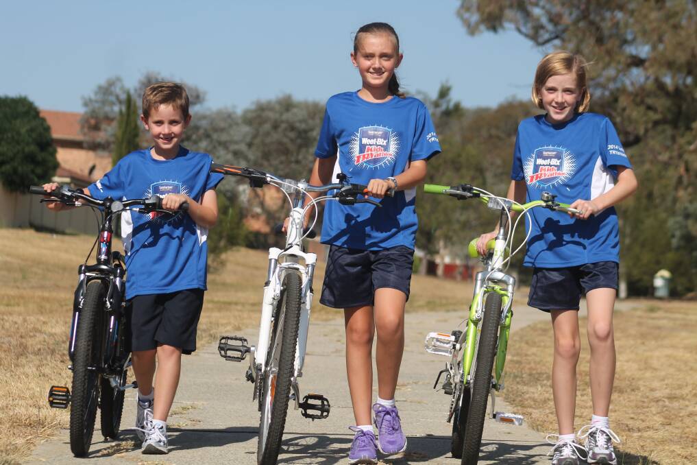 Jerra siblings Jack (left), Brooke and Emma will participate in this weekend's Weet-Bix TRYathlon, the world's largest children's triathlon event. Photo: Andrew Johnston