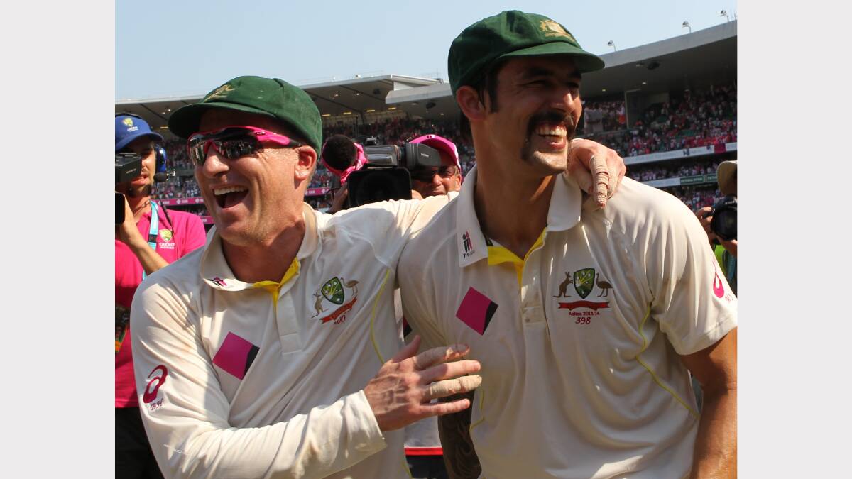 Queanbeyan junior Brad Haddin (left) celebrates with Australian teammate Mitchell Johnson after playing a pivotal role in regaining the Ashes. Photo: Fairfax Media