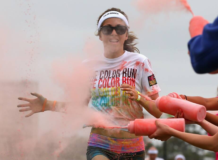 Competitors run through the colour stations during the Colour Run in Melbourne, Australia. Photo by Quinn Rooney/Getty Images