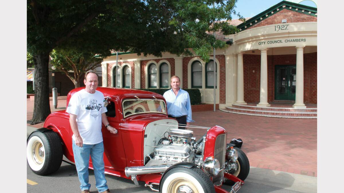 Hot-rodder Brian Carvolth and mayor Tim Overall take a spin in a 1932 Ford Coupe.