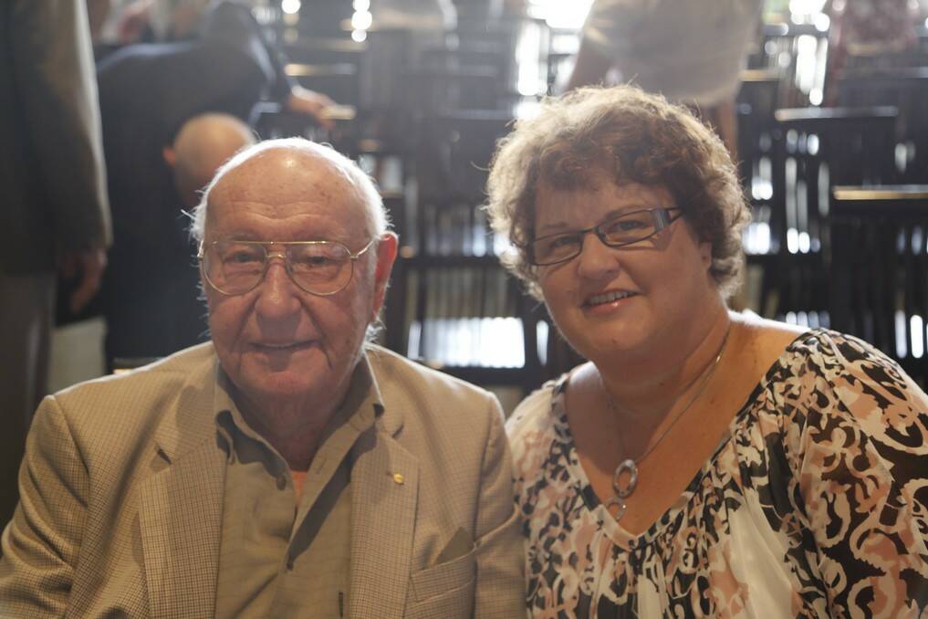 2014 Monaro Woman of the Year Trudy Taylor with her grandfather Jim Woods, 100, who she said inspired her to volunteer. Mr Woods still gives him time to help run the Queanbeyan Printing Museum.