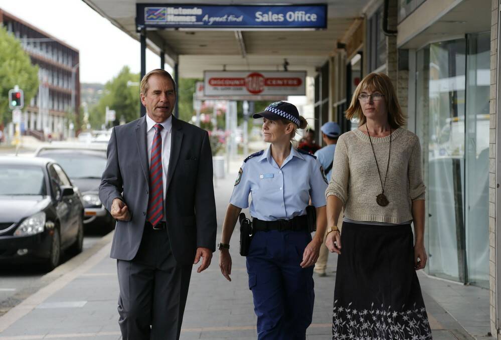 Queanbeyan City Council and local police are working together to educate business owners on crime prevention following the recent spate of break and enters. Pictured is mayor Tim Overall, senior constable Naomi Nemec and community development officer Samantha Swales. Photo: Kim Pham.