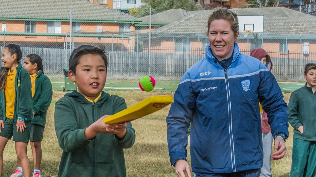 Cricketer Alex Blackwell supervises some cricket drills at Queanbeyan West Primary School on Monday. Photo: Karleen Minney