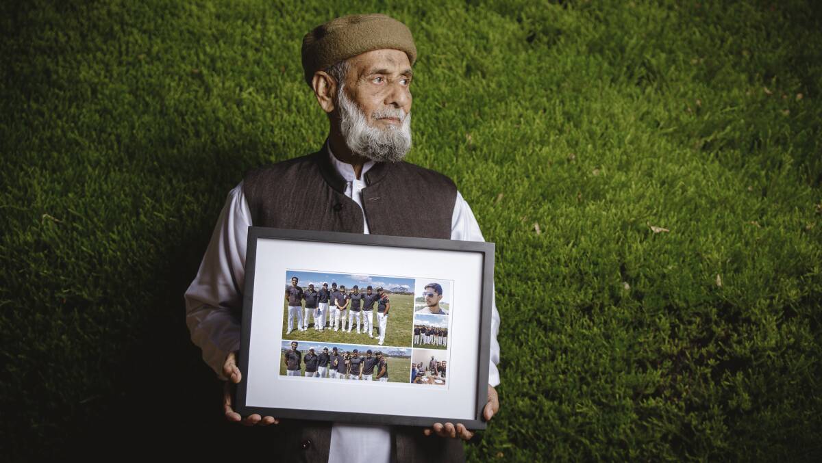 Mohammad Akbar with photos of his son Zeeshan, who tragically died last year while working at a service station in Queanbeyan. Photo: Sitthixay Ditthavong