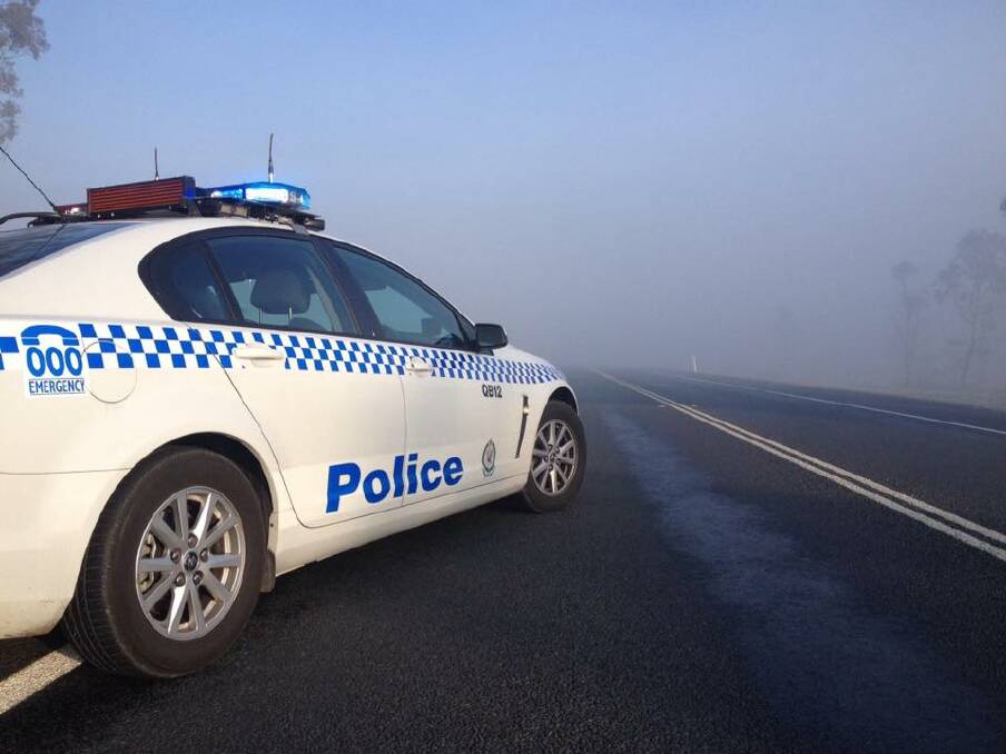 Monaro Police keeping a close eye on the Kings Highway this morning, which was covered in thick fog and heavy smoke. Photo: Facebook/ Monaro LAC.