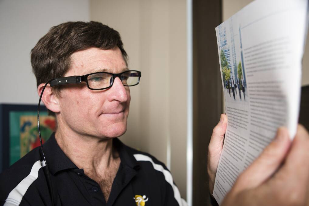 Roy Daniell is one of the first people in the ACT to try out the OrCam MyEye, a new device that reads to people with vision impairment. Photo: Jamila Toderas