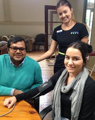 Emma Benson, Shahad Hasan and Jessica Neill during a free health check.