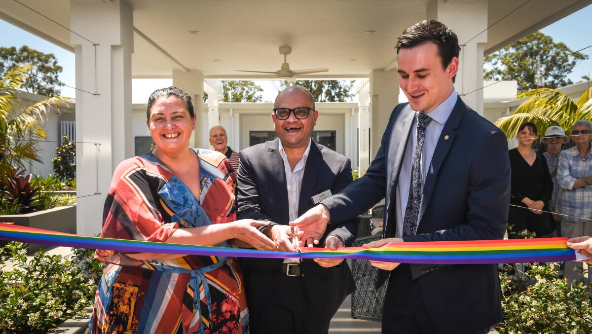 RAINBOW RIBBON: Queensland AIDS Council CEO Rebecca Reynolds, Arcare CEO Colin Singh, Local Liberal state member for Bonney, Sam OConnor at the opening of Arcare Parkwood.