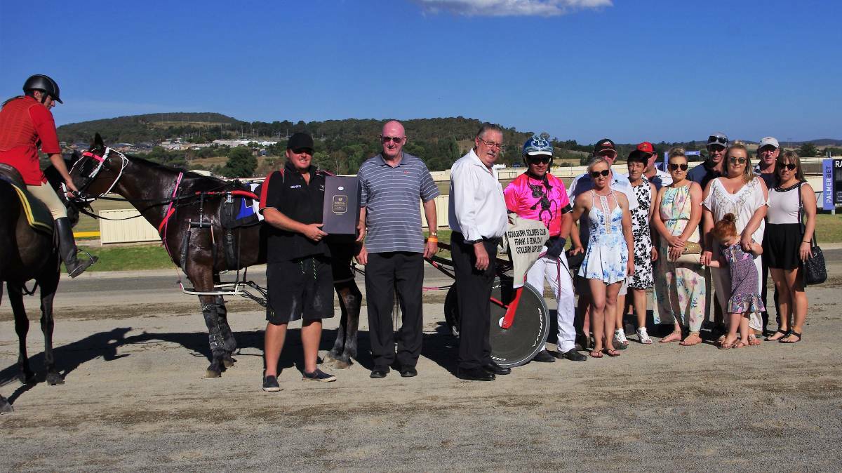 WINNER: The Frank and Edna Day memorial winner Yayas Hot Spot driven by Andy McCarthy with Mick Donnelly from the Goulburn Soldiers Club making the presentation. Photo: Darryl Fernance