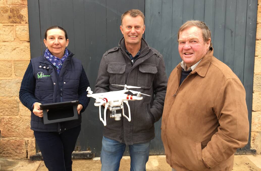 FARMING TOOL: Katrina Nixon from Roslyn with a tablet used in conjunction with drones, David Mellers holding a quadcopter similar to ones commonly used by farmers for agricultural applications and John Klem chairperson.