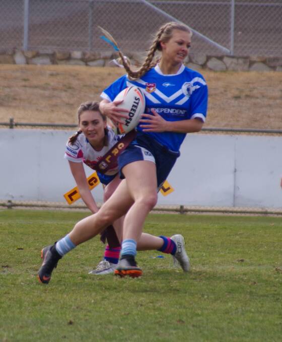 DETAGGED: Blues league tag speedster Kody-Leigh Hirst has her tag pulled by Goulburn Bulldogs' Grace Marshall during the game. Photo: Darryl Fernance