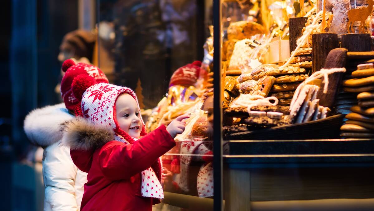 Stocking up at a traditional Christmas market in Germany. Picture: Shutterstock