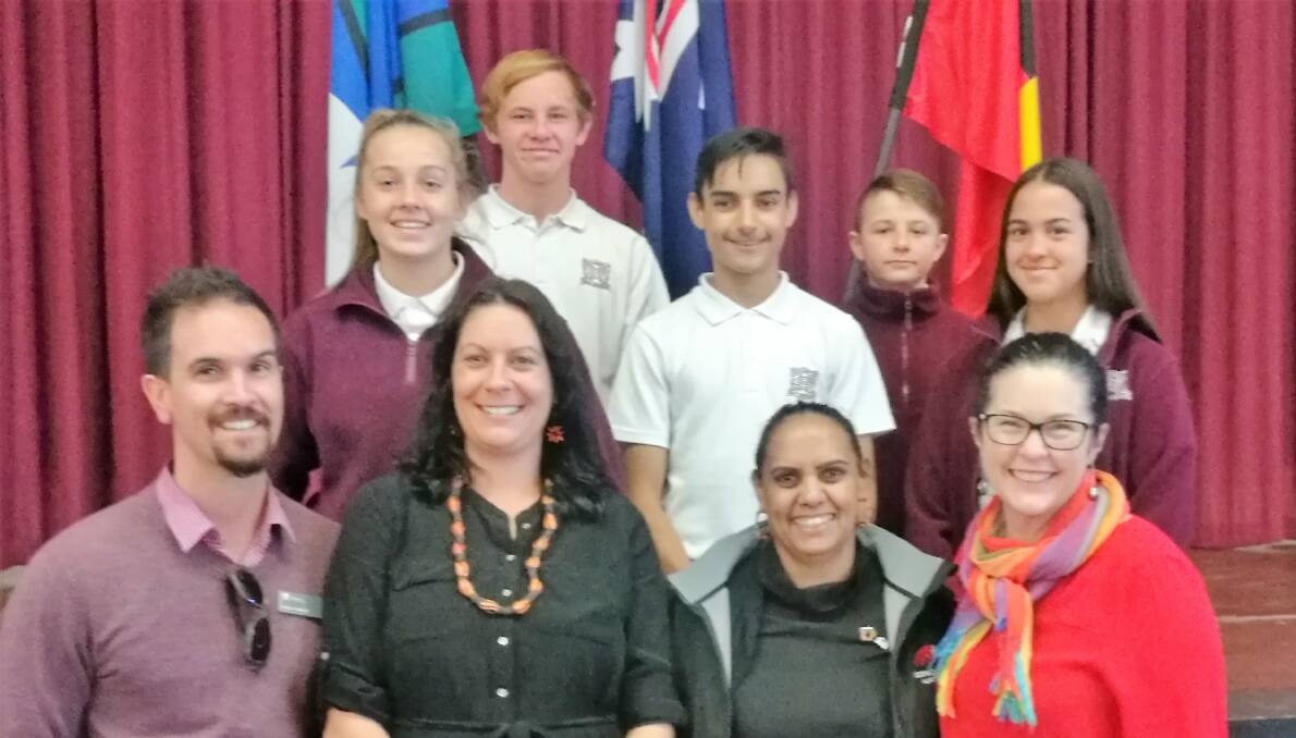 Back: QHS students Talisha Williams, Corey Hutchison-Wright, Tyson Livermore, Toby Mailes and Grace Martin. Front: Peter Hewitt, Maddie Williamson, Queanbeyan AECG president Esma Livermore, QHS principal Jennifer Green. Photo: Supplied