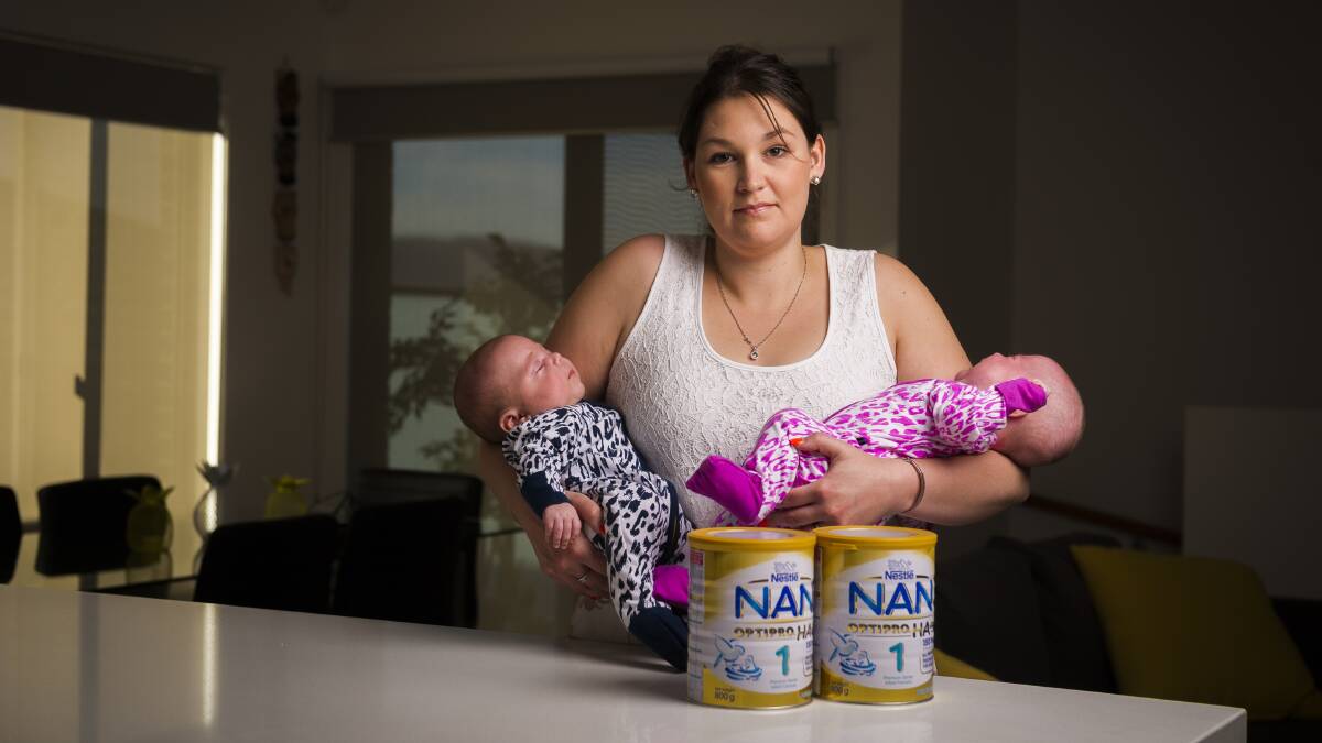 Googong mum Tegan Shirbin, with her 11-week-old twins Troy and Octavia, struggles to buy enough baby formula due to restrictions put in place by retailers. Photo: Dion Georgopoulos