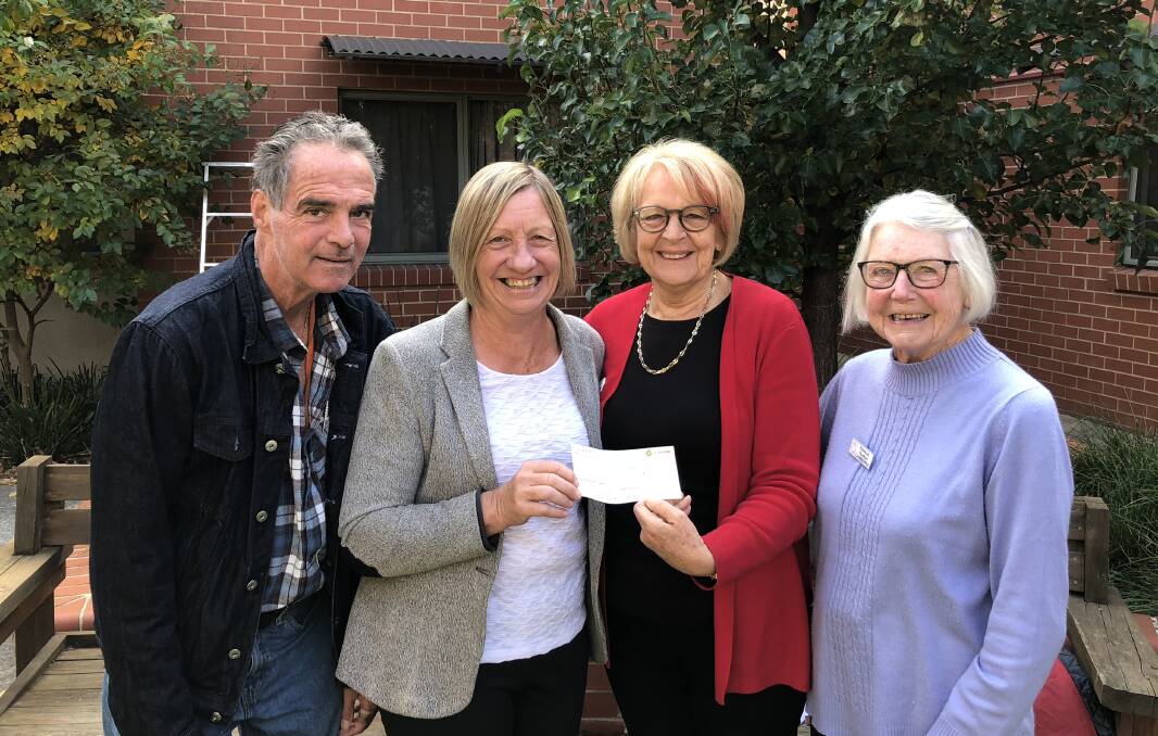 HOME resident Stephen and manager Anne Pratt receive a donation from Quota president Pat Zutt and long-time member Patricia Rudkin. Photo: Elliot Williams