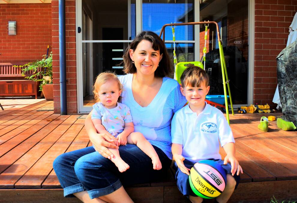 Shannon Beck, with daughter Ainsleigh (1) and son Austin (5), hopes to see a public school in Googong soon. Photo: Elliot Williams