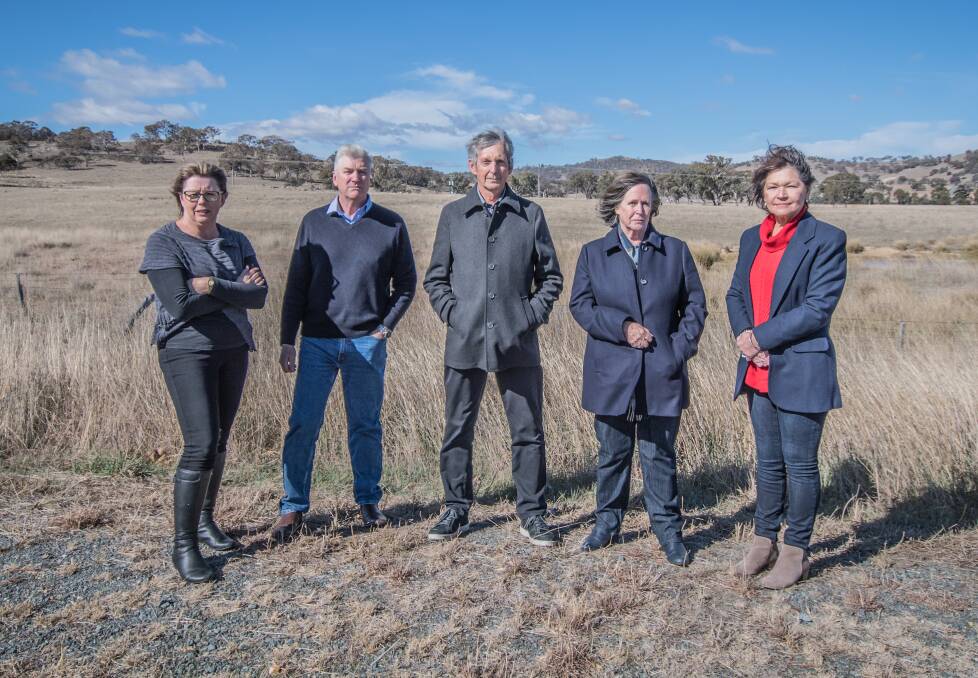 Beth and Geoff Smith, Brian and Joanna Hartfield and Wendy Hubbard are opposed to the proposed cemetery at Googong. Photo: Karleen Minney.