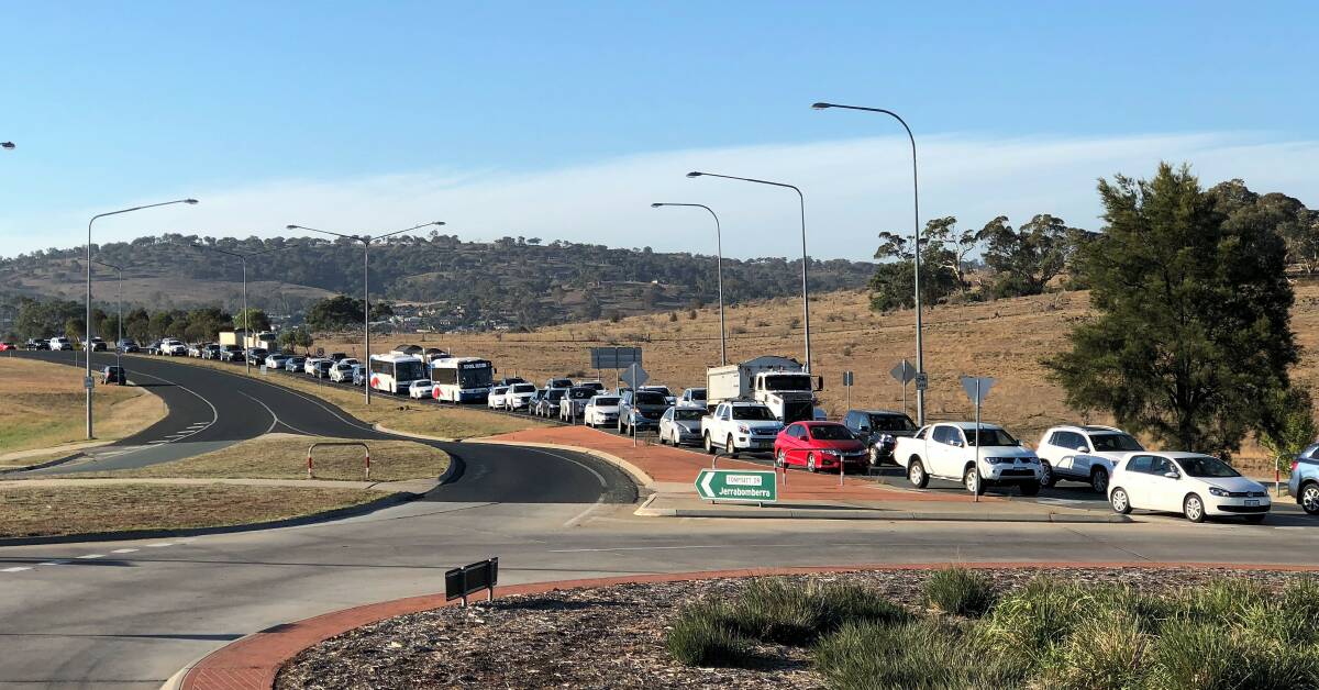 Traffic backs up each morning at the roundabout at Lanyon and Tompsitt Drives. Photo: Elliot Williams