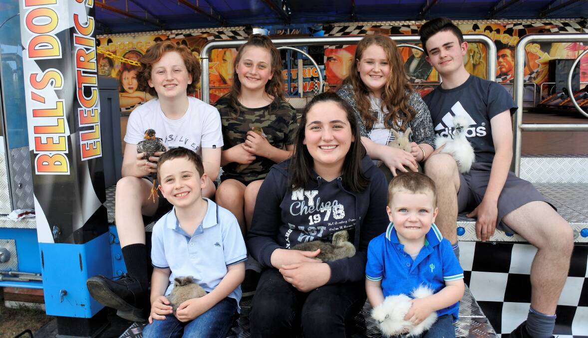 The Zarb family has been involved in the Queanbeyan Show for decades. Back row: Sam, Samantha, Jasmine and Joe Zarb. Front row: Michael, Grace and Angus Zarb with their farmyard friends. Photo: Elliot Williams