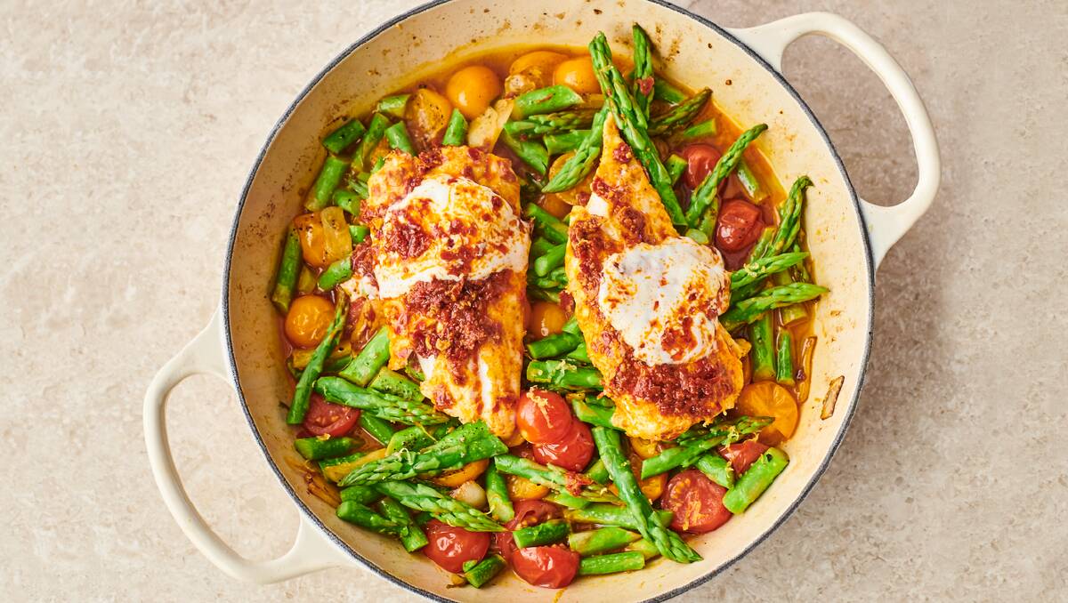 Quickest white fish tagine with sweet cherry tomatoes, harissa, asparagus and fluffy couscous. Picture: Levon Biss