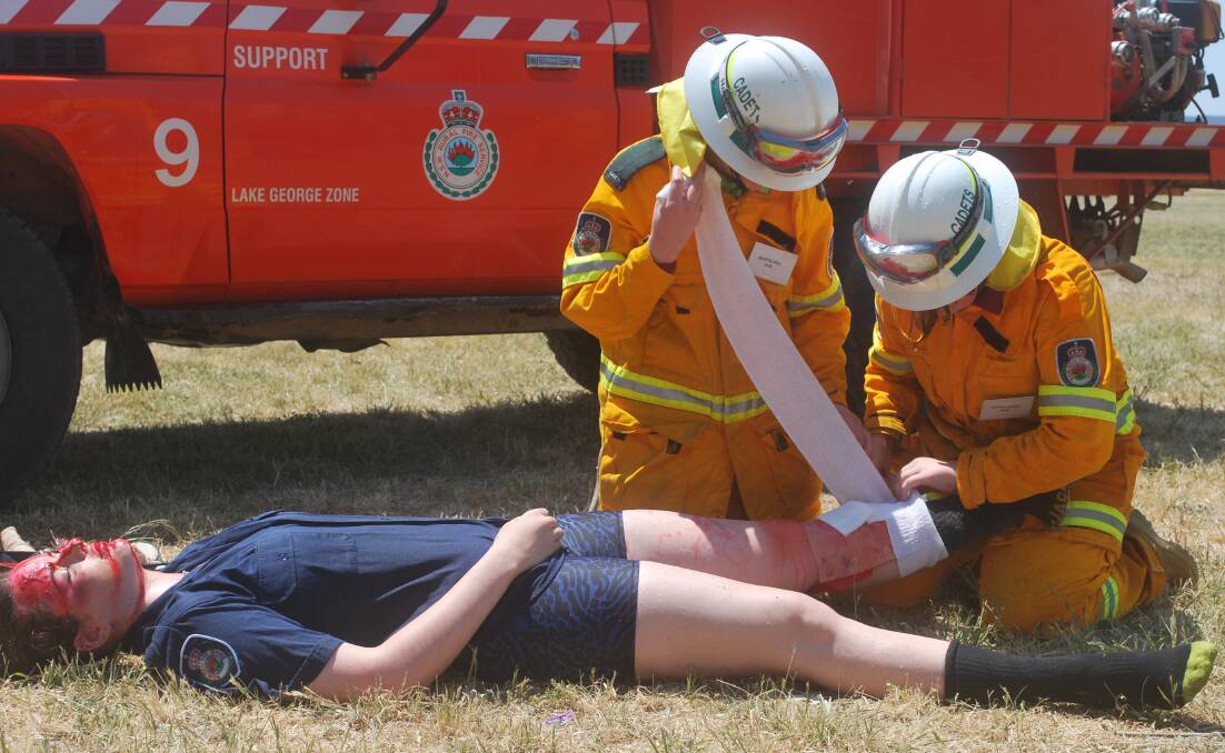 First aid is an essential part of RFS training. Cadets tend to 'a victim of a car accident' during their graduation at Queanbeyan High School.