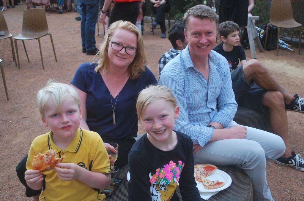 Jodi De Ligt and husband Robert, from Forbes Creek near Hoskinstown, enjoy the night (and pizza) with son Arie, 6, and daughter Oenone, 8.