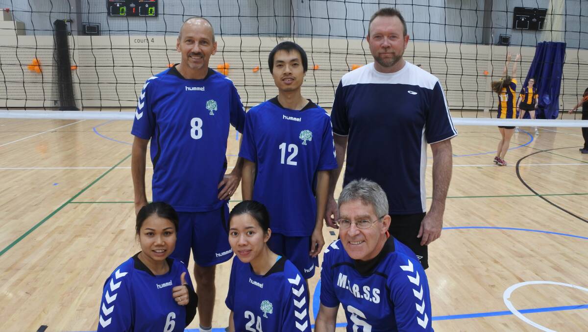 Coming together: Team members Peter Knaus, Sean Feenan, Khanh Le, Tho Do Duy and Tainta Jaemsri, who were competing in the volleyball. Photo: Andrew Brown
