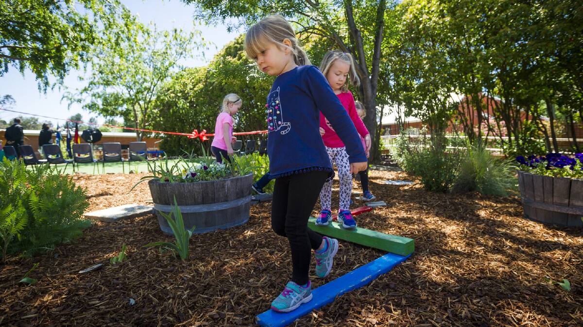 Play time: Preschool students Elise Sawbridge and Matilda Bignall testing out the play area in the new sensory garden. Photo: Supplied