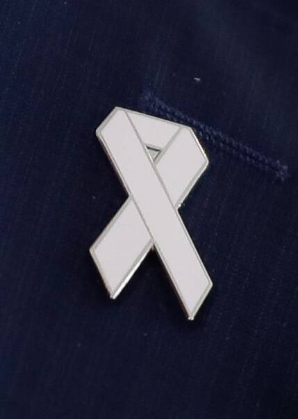 The founders came up with the idea of a white ribbon as a man’s pledge to never commit, condone or remain silent about all forms of violence against women.