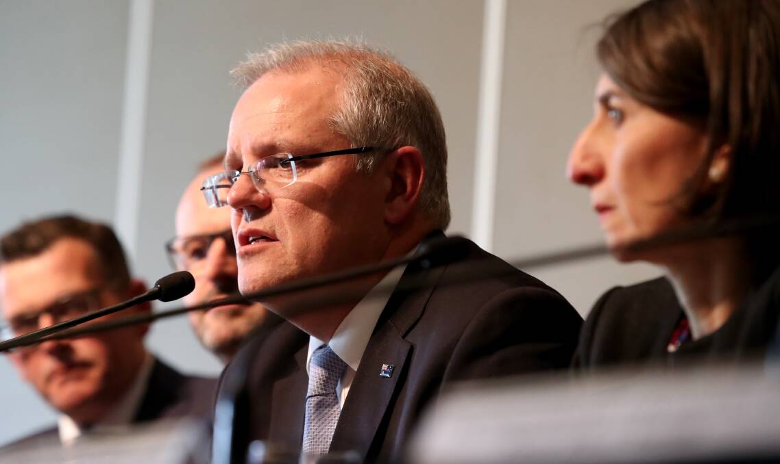 Prime Minister Scott Morrison flanked by state premiers during the Council of Australian Governments  meeting in Adelaide. Photo by Kelly Barnes.