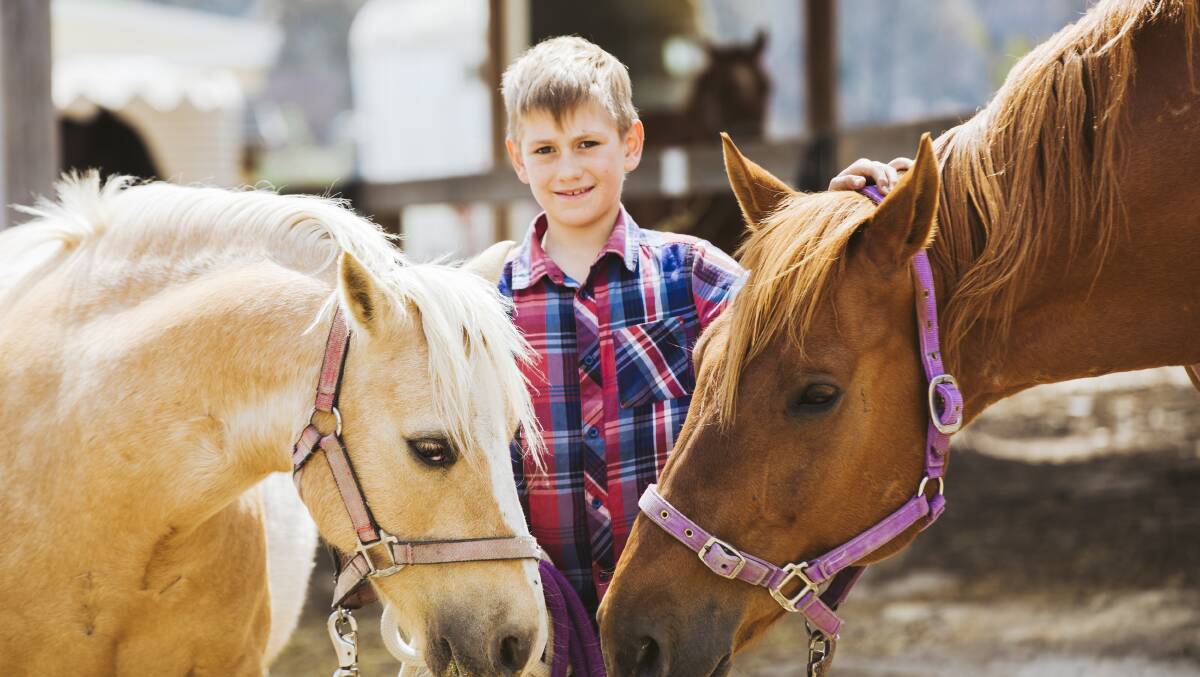 Helen Faulker's Bombay property and horses survived Friday's inferno. Helen's son, Dexter Faulkner, 8. Picture: Jamila Toderas