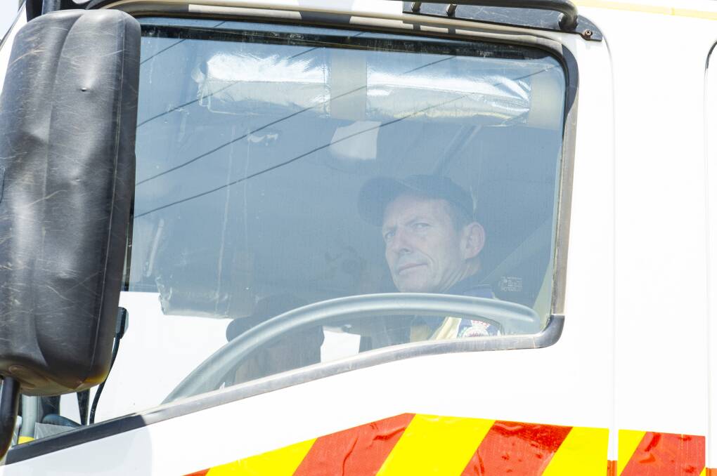Former prime minister Tony Abbott joins the fire effort at Adaminaby for the worsening conditions on Friday. Picture: Dion Georgopoulos