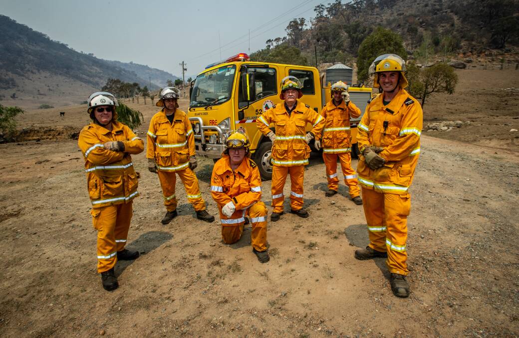 A special task force of Queensland Fire Service volunteers working on the Orroral fires (from left) Russell Alfredson, James Lowe, Pat Ralph, Tony Shaw, Tyson Marshall and strike team leader Rob Sargent. Picture: Karleen Minney