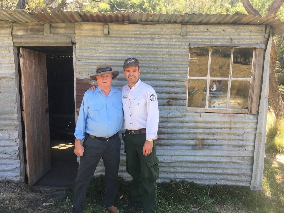 BUILT HISTORY: Max Oldfield with Brett McNamara at Oldfield's Hut, a former simple stockman's shelter for Max that is now being preserved by the Kosciuszko Huts Association.