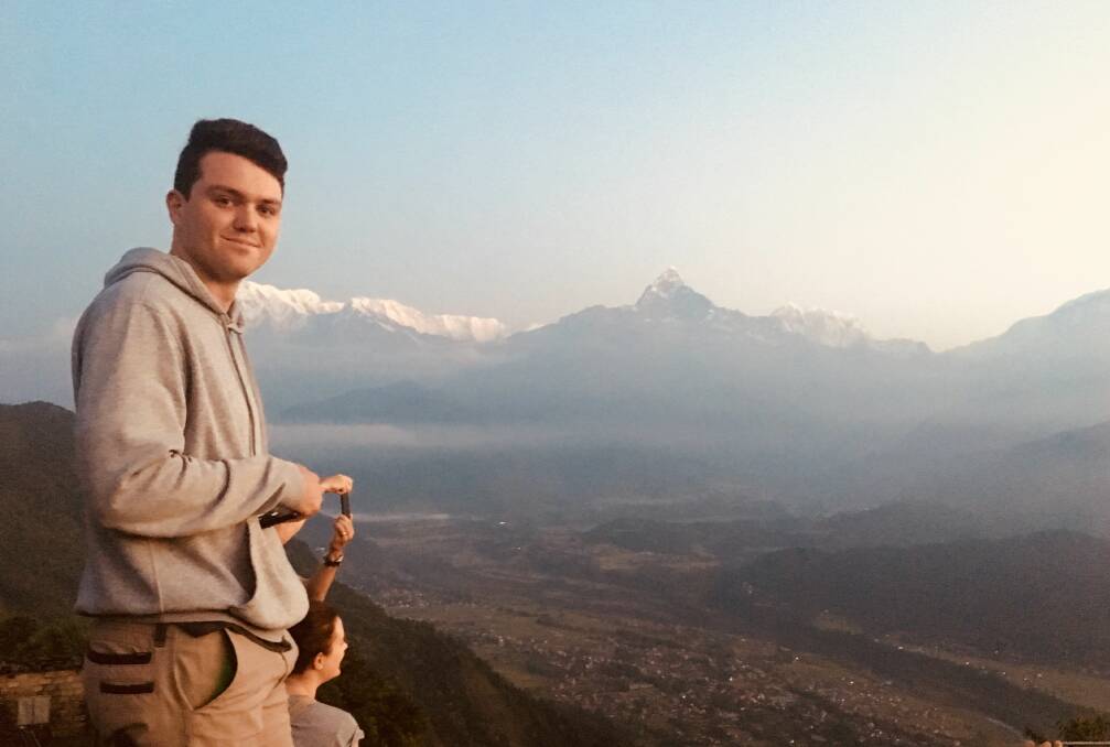 UP AND AWAY: Bearing witness to a dawning of new day, Brett McNamara's son Jordan takes in the sights of the Annapurna Range of the Himalayas, north central Nepal. 
