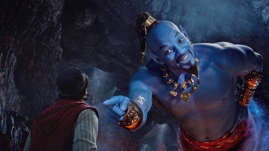 MUDDLED MAGIC: Aladdin, played by Mena Massoud, meets the larger-than-life blue Genie, Will Smith, in Disney's live-action adaptation "Aladdin". 
