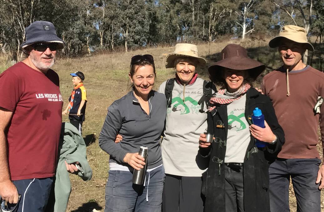 HELPING HANDS: Local volunteers include the Urambi Hills ParkCare group, which has been working hard to regenerate the hills beyond Tuggeranong.