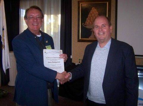 Gary Pettigrove (right) was honoured to receive his award from Barry Welsby.